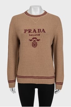 Brown straight-cut sweater with a brand logo