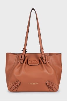 Brown leather tote bag with tag