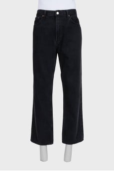 Men's black straight-leg jeans with buttons