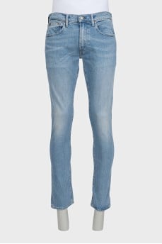 Men's light blue straight fit jeans with a button