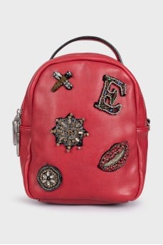 Red leather backpack with decor