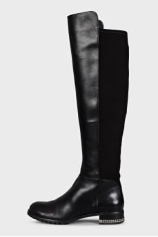 Black leather boots with a zipper