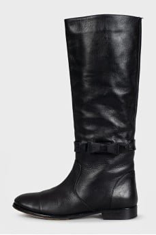 Black leather boots with a bow