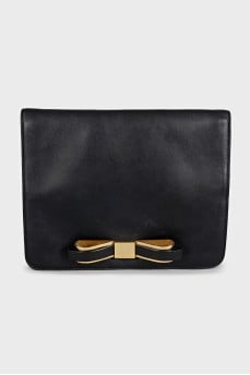Black leather clutch with a bow