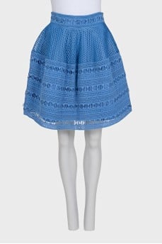 The blue skirt is decorated with drapery