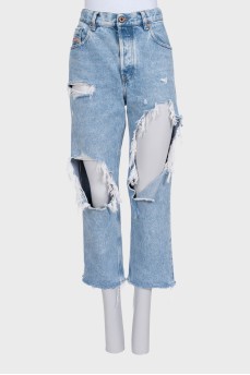 Blue distressed jeans with frayed edges