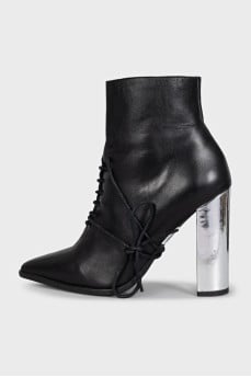 Black leather ankle boots with a pointed toe