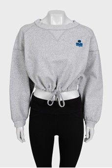 Cropped gray sweatshirt with a patch