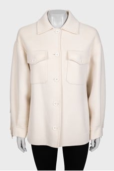 Short wool coat decorated with fringe