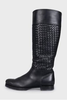 Black leather boots decorated with braiding