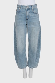Tapered distressed jeans with tag