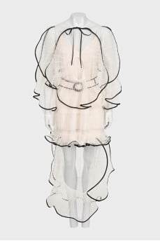 Transparent dress decorated with ruffles with a tag