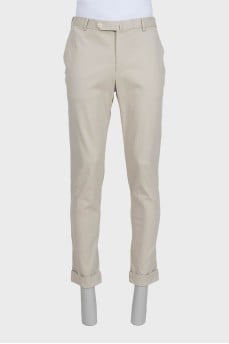 Men's beige trousers with a zipper and buttons