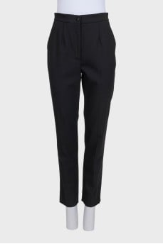 Black straight-leg wool trousers with tag
