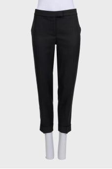 Black cuffed trousers with tag