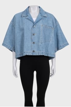 Blue denim jacket with tag