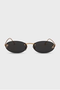 Oval sunglasses with narrow gold temples