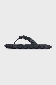 Black flip-flops with a chunky sole