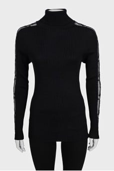Black turtleneck with lace inserts on the sleeves