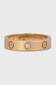Love ring made of gold with a diamond
