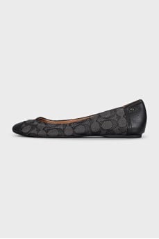 Black ballet flats made of fabric and leather with a print