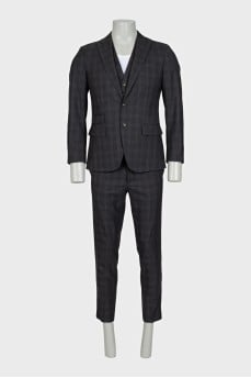 Men's three-piece suit in a checkered print