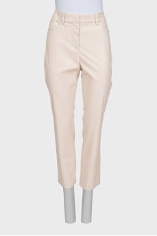 Beige tapered trousers made of eco-leather