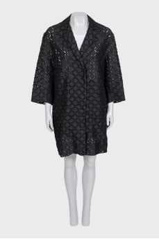 Perforated suit consisting of a jacket and shorts