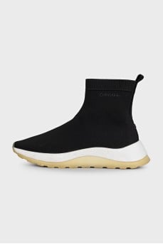 Black textile sneakers with a white sole