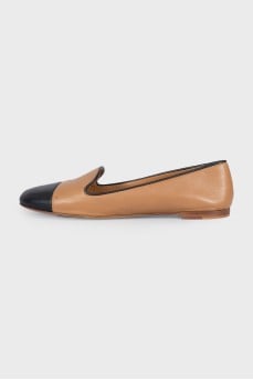 Brown leather ballet flats with black toe