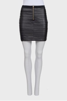 Mini skirt with a zipper and pleats