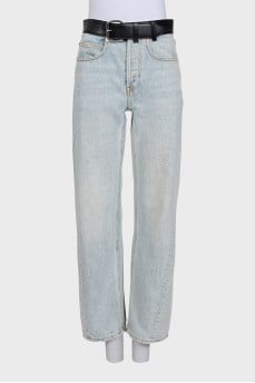 Light blue straight-leg jeans with a black belt