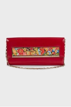 Red leather clutch decorated with enamel