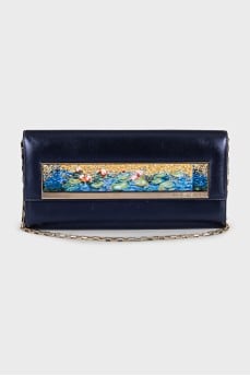 Blue leather clutch decorated with enamel