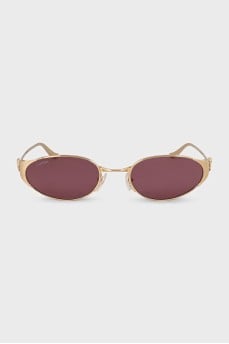 Sunglasses with purple lenses and gold frames