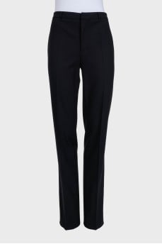 Black straight-leg trousers with creases
