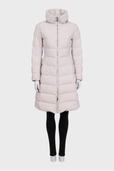 A fitted, elongated down jacket with a zipper