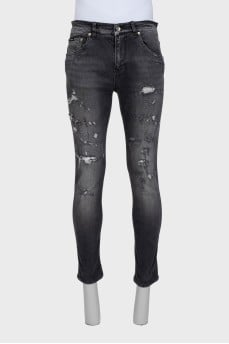 Dark gray slim fit jeans with a distressed effect
