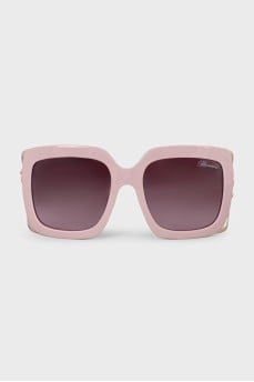 Pink sunglasses with logo on the temples