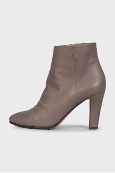 Gray ankle boots with a gold zipper