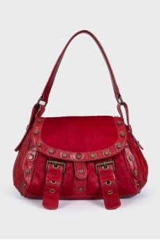 Bag made of fleecy leather decorated with rivets