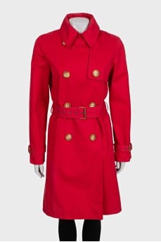 Double-breasted trench coat in red