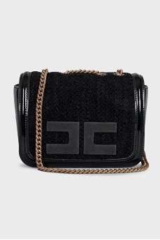 Black bag with a textile logo