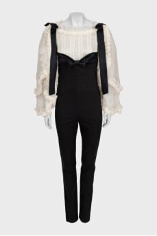 Black jumpsuit with white silk top