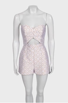 White jumpsuit with printed shorts