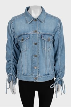 Blue denim jacket with tie sleeves