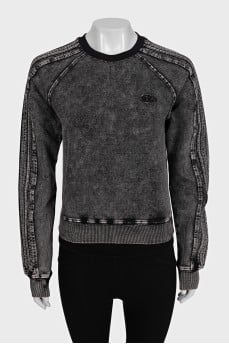 Gray sweatshirt with a distressed effect