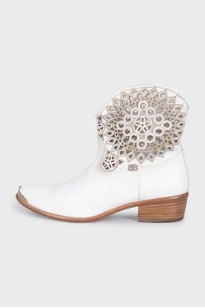White leather Cossack boots decorated with perforations
