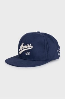 Men's cap decorated with embroidery and a tag