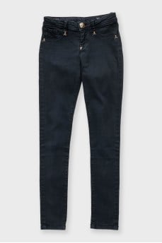 Black skinny jeans with signature gold trim